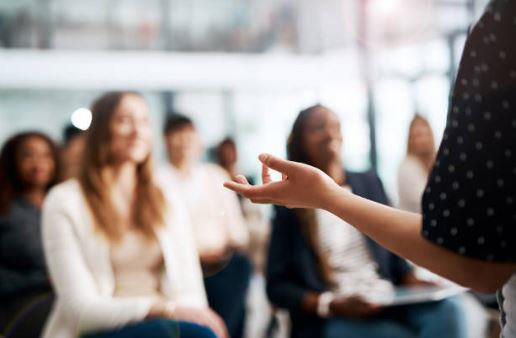 Woman in front of audience